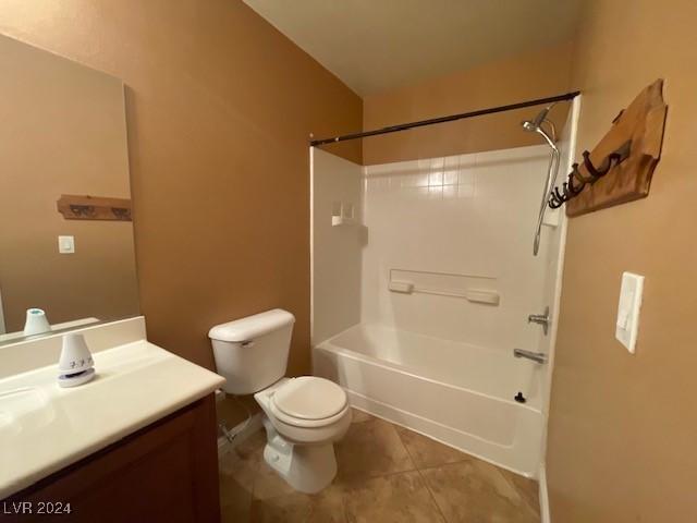 full bathroom featuring tile patterned floors, vanity, toilet, and tub / shower combination