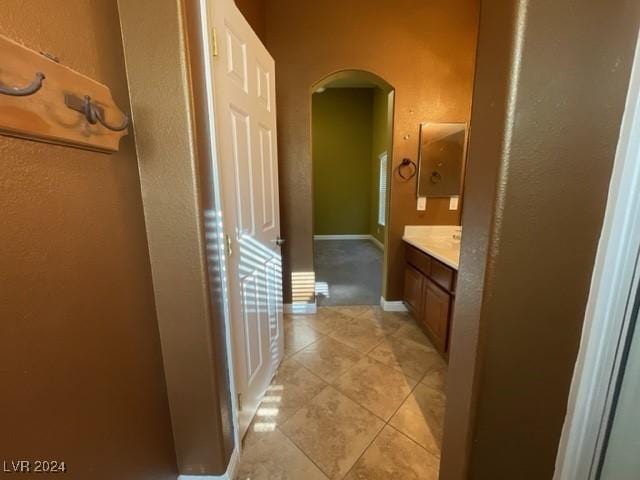 bathroom featuring tile patterned flooring and vanity