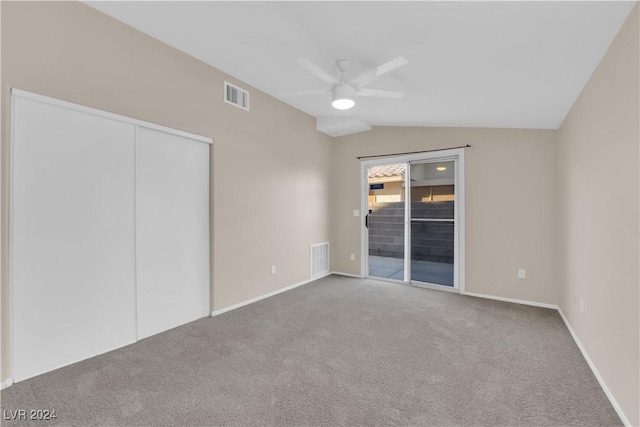 unfurnished bedroom with carpet flooring, access to outside, ceiling fan, a closet, and lofted ceiling