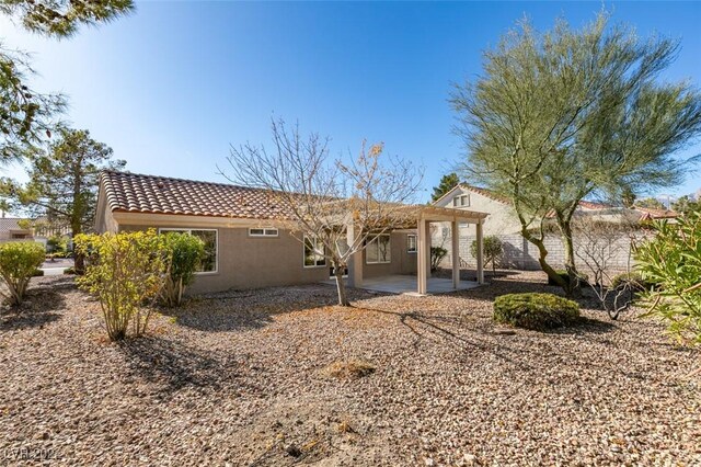 back of property with a patio area