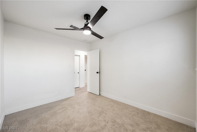 carpeted empty room with ceiling fan