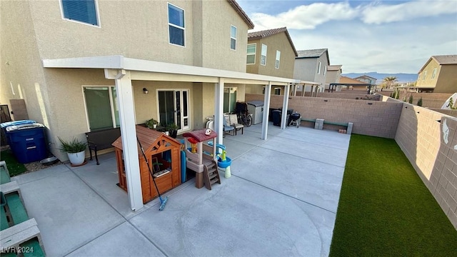 back of house with a patio