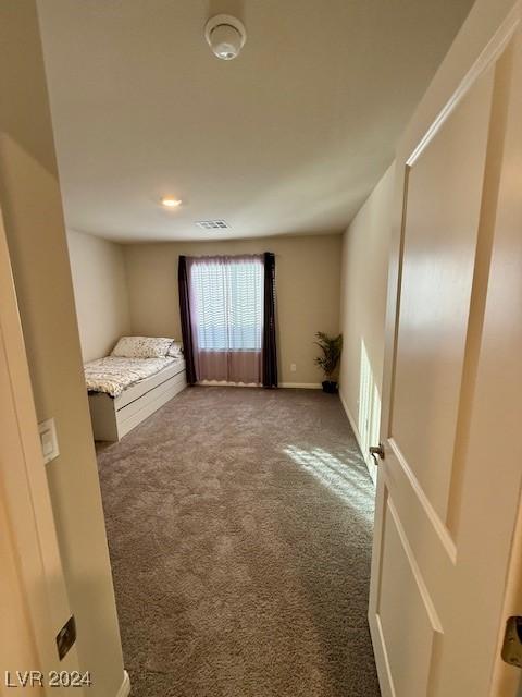 unfurnished bedroom with carpet flooring