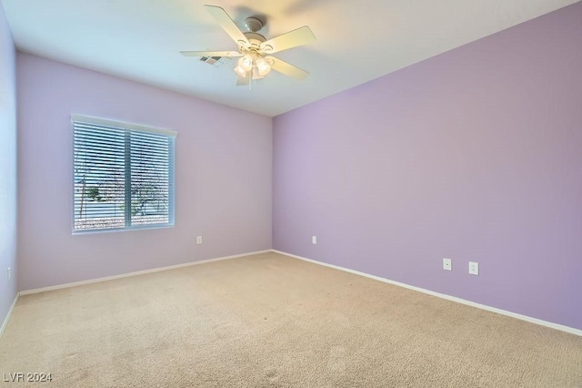 carpeted empty room with ceiling fan