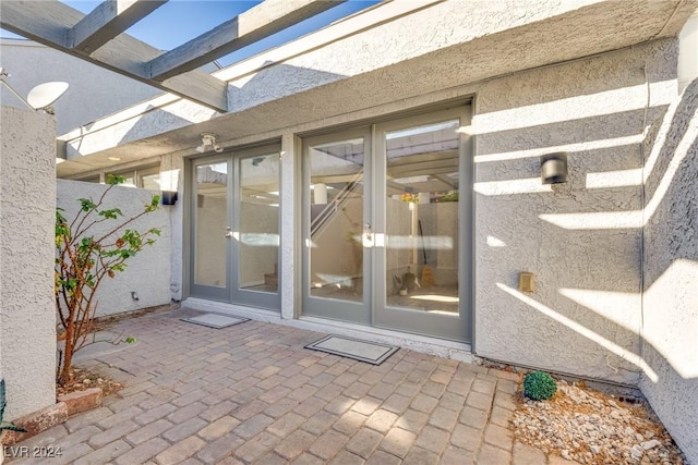 doorway to property featuring a patio and french doors