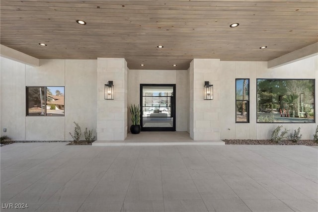 view of exterior entry featuring stucco siding