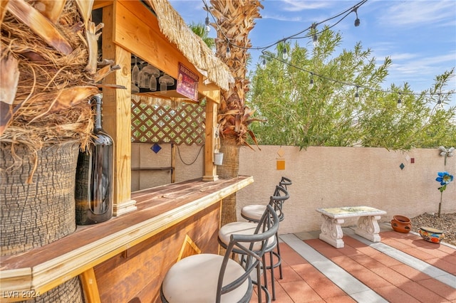 view of patio featuring an outdoor bar