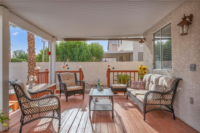 wooden deck featuring an outdoor hangout area