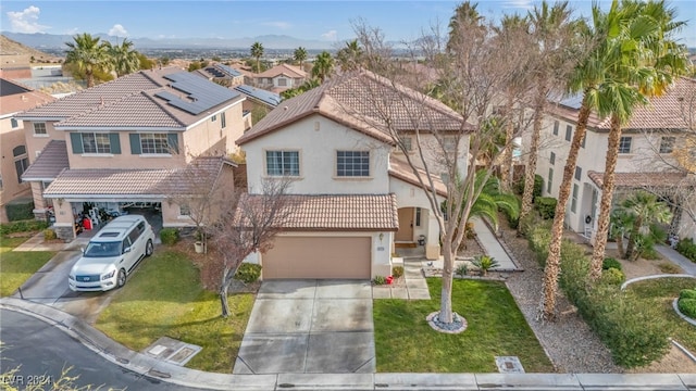 view of front of home with a front yard and a garage