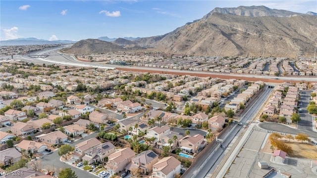 birds eye view of property featuring a mountain view