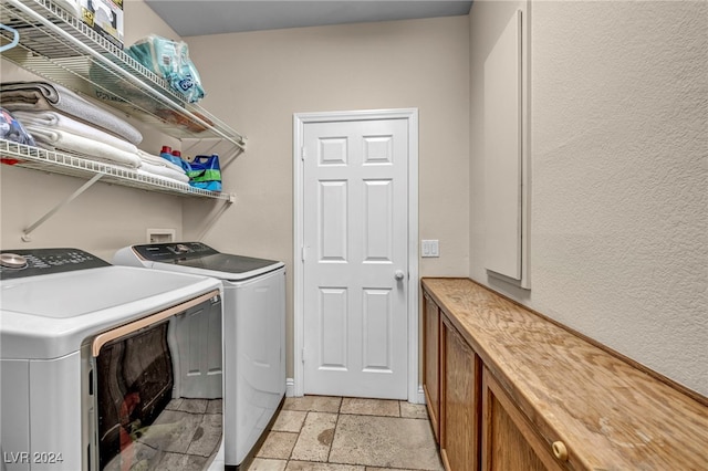 clothes washing area featuring washing machine and clothes dryer