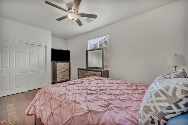 bedroom featuring wood-type flooring, a closet, and ceiling fan