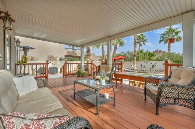 wooden terrace featuring outdoor lounge area