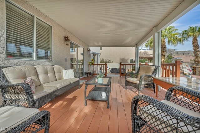 wooden deck featuring outdoor lounge area