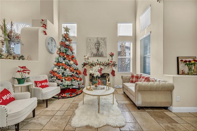 living area with a towering ceiling