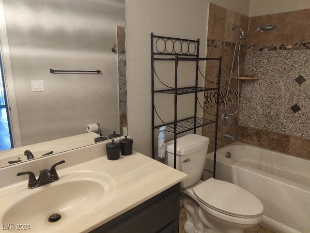 full bathroom featuring vanity, toilet, and tiled shower / bath