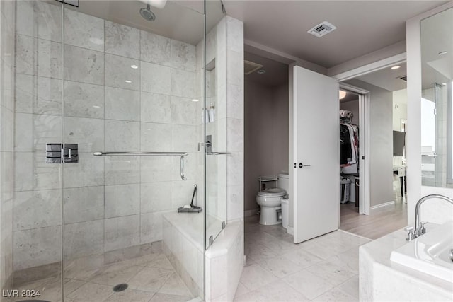 bathroom with toilet and separate shower and tub