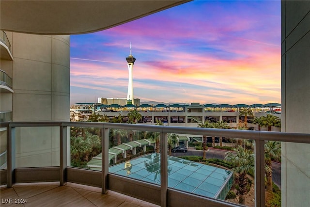 view of balcony at dusk