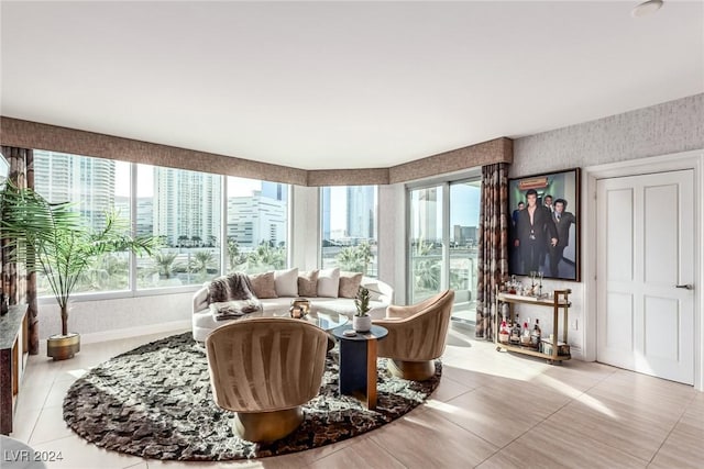 living room featuring a healthy amount of sunlight and light tile patterned flooring