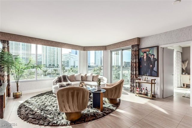 living room featuring light tile patterned floors and a wealth of natural light