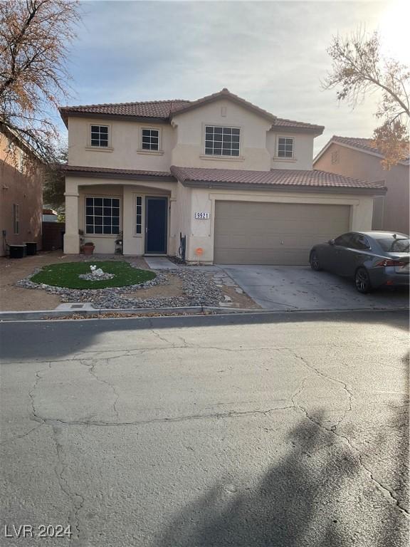 front facade with a garage