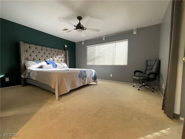 carpeted bedroom with ceiling fan