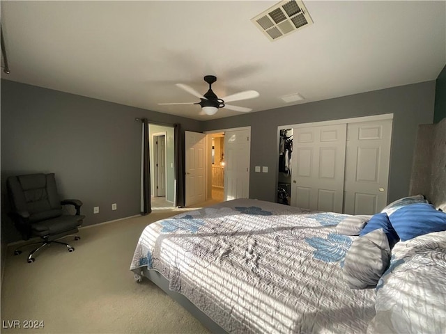 bedroom with carpet flooring, ceiling fan, and a closet