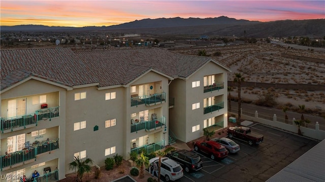 outdoor building at dusk with a mountain view