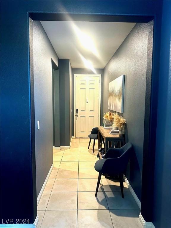 hallway with light tile patterned floors