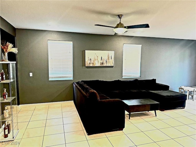 tiled living room with ceiling fan