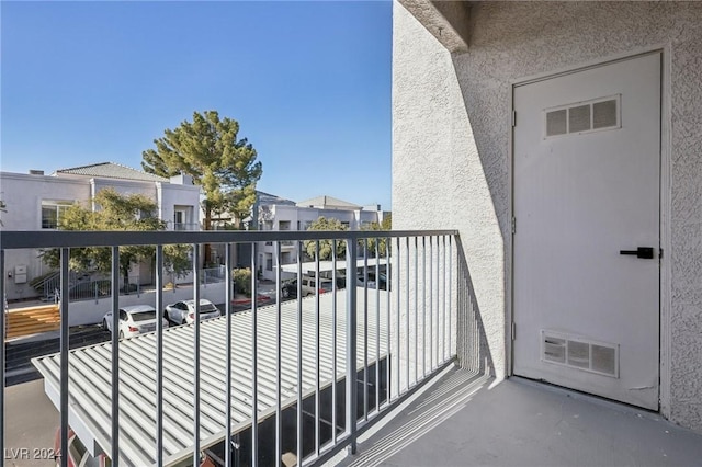 balcony with a residential view and visible vents