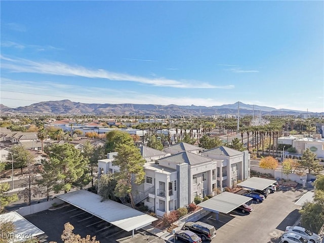 birds eye view of property featuring a mountain view