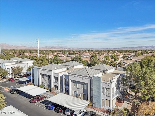 drone / aerial view with a residential view and a mountain view