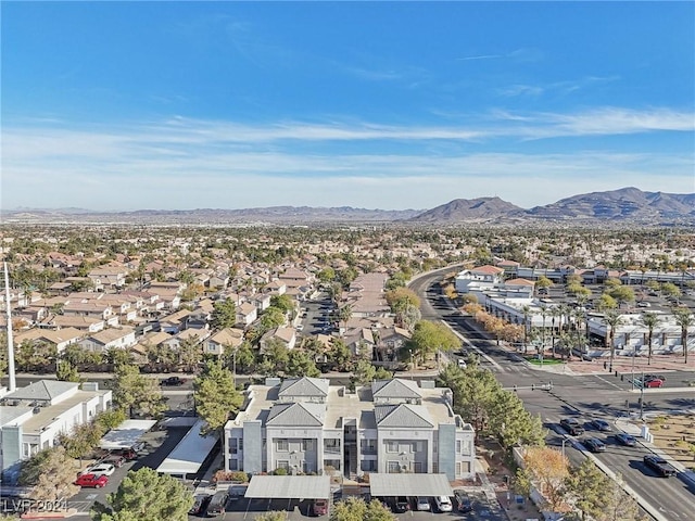 drone / aerial view featuring a residential view and a mountain view