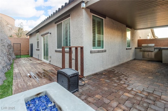 view of property exterior with a fire pit, cooling unit, and a wooden deck