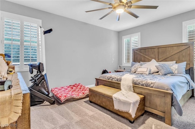 bedroom with ceiling fan and carpet