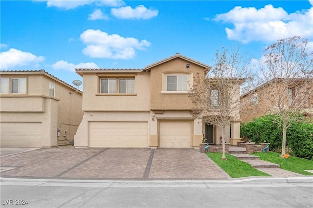 view of front of property with a garage