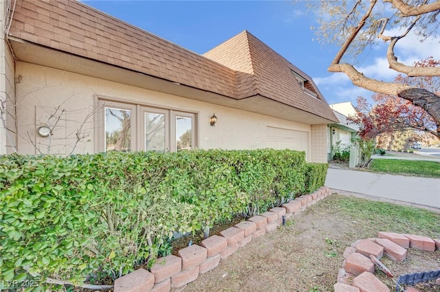 view of property exterior with a garage