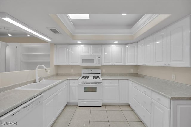 kitchen featuring sink, white cabinets, a raised ceiling, crown molding, and white appliances