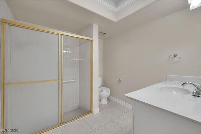 bathroom featuring tile patterned floors, toilet, a shower with shower door, ornamental molding, and vanity