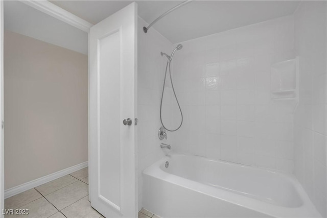 bathroom featuring tile patterned flooring and tiled shower / bath