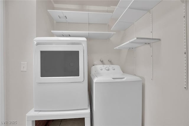 washroom featuring washing machine and dryer