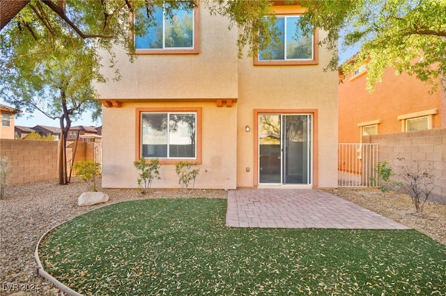 rear view of house with a patio