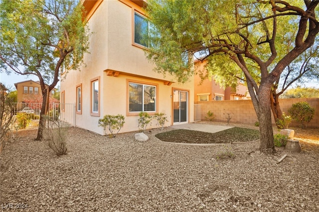 back of property with a patio area