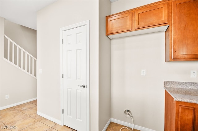 washroom with light tile patterned floors