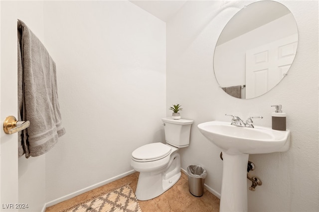 bathroom with toilet and sink