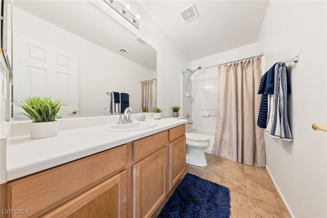 full bathroom with shower / bath combo, vanity, and toilet