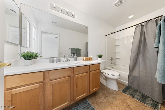 full bathroom with shower / bath combo, vanity, and toilet