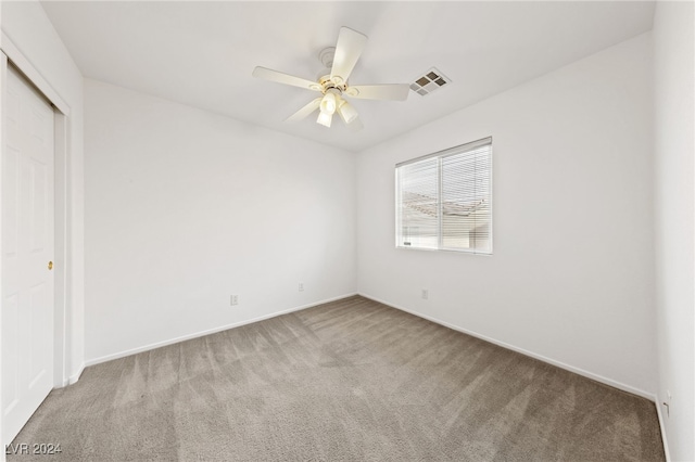 unfurnished bedroom featuring ceiling fan, carpet floors, and a closet