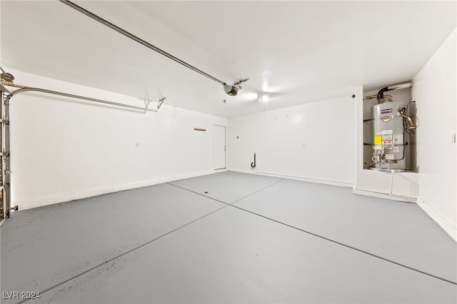 garage featuring a garage door opener and water heater